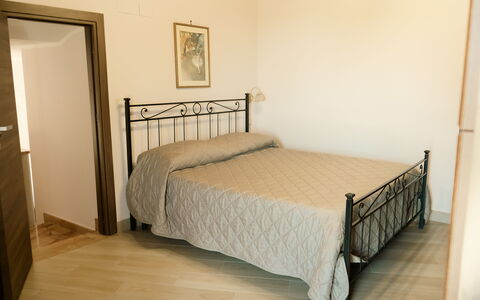 Villa Saponara: Bed, Furniture, Bedroom, Bedding, Bed Sheet, Floor, Interior Design, Flooring, Wood, Room