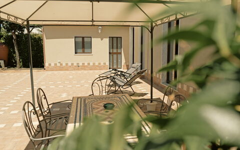 Villa Saponara: Furniture, Flooring, Floor, Chair, Outdoor Furniture, Shade, Outdoor Structure, Outdoor Table, Patio, Garden
