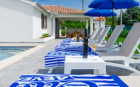 Gverino: Blue, White, Azure, Sky, Building, Architecture, Outdoor Furniture, Umbrella, Shade, Line