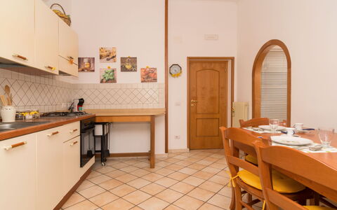 Mansardina sui Due Golfi: Cabinetry, Furniture, Property, Building, Table, Countertop, Wood, Orange, Chair, Drawer