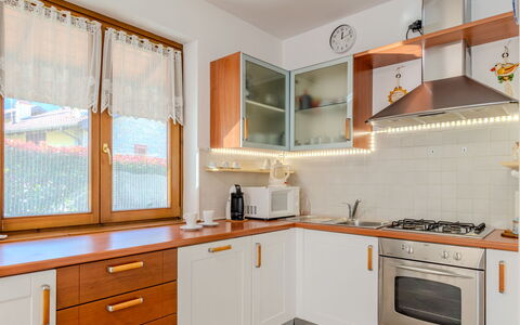 Mina: Countertop, Cabinetry, Property, Furniture, Window, Building, Kitchen, Wood, Drawer, Kitchen Stove