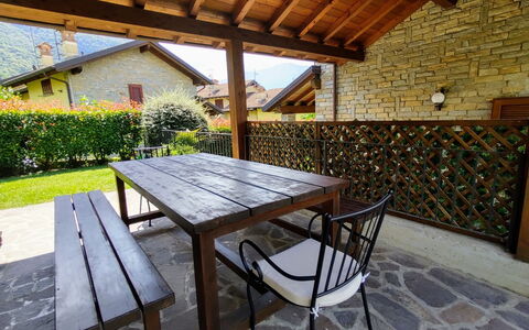 Mina: Table, Plant, Property, Furniture, Outdoor Table, Wood, Chair, Shade, Outdoor Furniture, Interior Design
