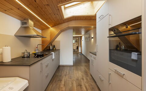Brienz Sunset: Kitchen, Countertop, Interior Design, Flooring, Kitchen Appliance, Wood, Ceiling, Floor, Major Appliance, Cabinetry