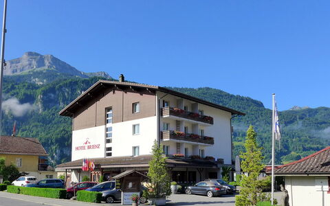 Brienz Sunset: Sky, Plant, Building, Mountain, Car, Window, Wheel, House, Infrastructure, Tree