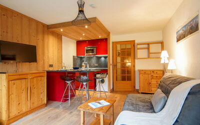Clos du Savoy 10.8: Furniture, Property, Cabinetry, Wood, Table, Countertop, Orange, Lighting, Interior Design, Living Room