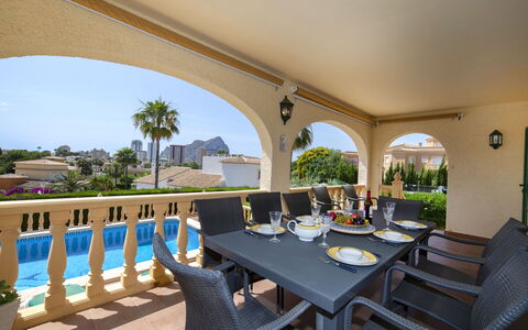 Marie Louise: Table, Plant, Furniture, Property, Sky, Chair, Building, Tree, Shade, Houseplant