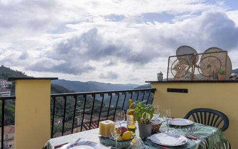 Pietrabruna 673: Cloud, Sky, Table, Tableware, Furniture, Property, Building, Plant, Chair, Flowerpot
