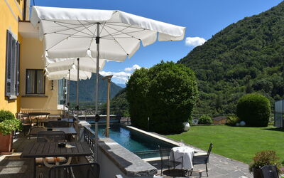 Intragna 55: Sky, Plant, Furniture, Building, Shade, Umbrella, Swimming Pool, Outdoor Furniture, Cloud, Window
