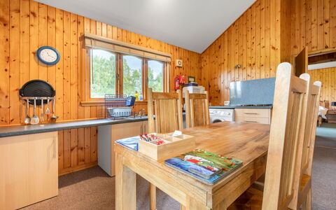 Loch Meilke 2 Bed: Table, Furniture, Cabinetry, Wood, Building, Window, Flooring, Wood Stain, Floor, Living Room