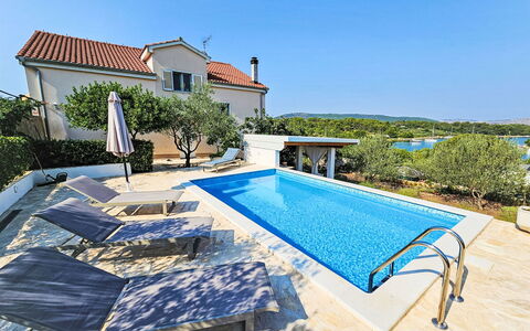 Katenas: Sky, Property, Plant, Building, Swimming Pool, Azure, Outdoor Furniture, Water, Rectangle, Shade