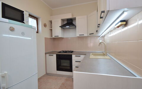 Ante: Cabinetry, Countertop, Property, Building, Kitchen Sink, Kitchen Appliance, Kitchen Stove, Kitchen, Home Appliance, Wood