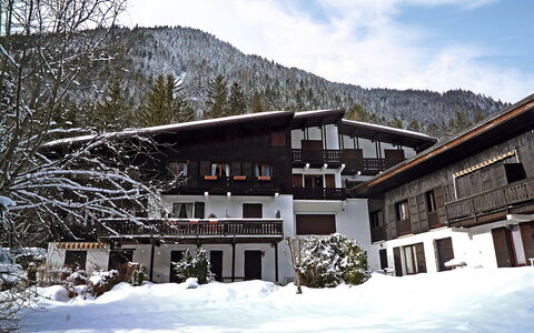 Les Charmoz: Cloud, Sky, Plant, Building, Snow, Property, Mountain, Window, Tree, House