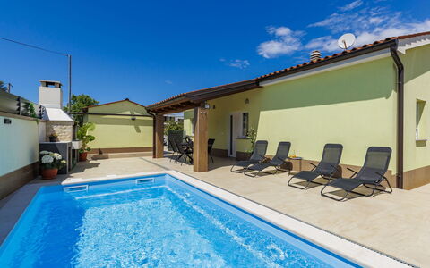 Laura: Swimming Pool, Flooring, Floor, Composite Material, Leisure, Resort, Shade, Tile, Chair, Hotel