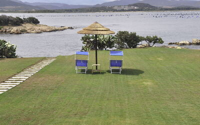 Cala Saccaia 13.2: Water, Sky, Plant, Building, Azure, Natural Landscape, Tree, Body Of Water, Beach, Terrain