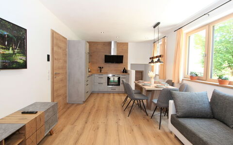 Bernadette: Table, Furniture, Couch, Wood, Picture Frame, Flooring, Floor, Plant, Living Room, Laminate Flooring