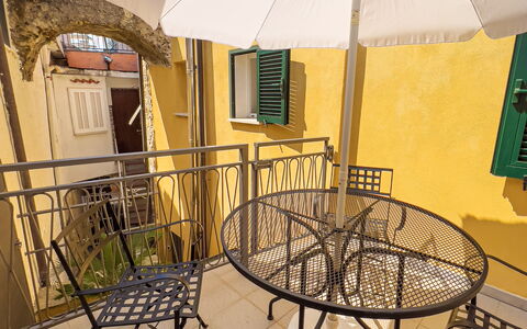 La Casetta Di Emma - Villa Faraldi: Building, Table, Umbrella, Shade, Window, Wood, Outdoor Furniture, Outdoor Table, Chair, Line