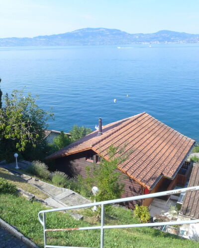 Le Cabanon: Sky, Water, Plant, Property, Building, Azure, Nature, Wood, Land Lot, Tree