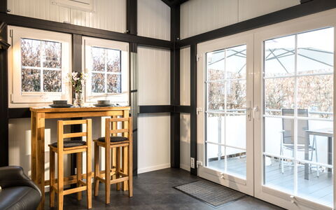 Tiny Haus Westerwald 16 Blue: Window, Building, Wood, Interior Design, Table, Door, Floor, Flooring, Shade