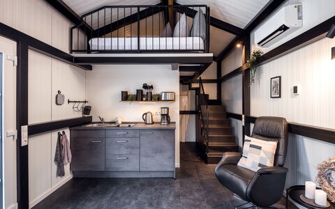 Tiny Haus Westerwald 16 Green: Furniture, Cabinetry, Property, Wood, Countertop, Interior Design, Picture Frame, Chair, Building, Floor