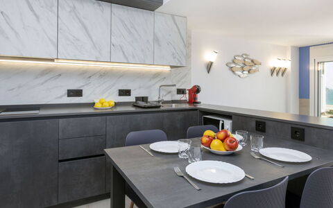Caravela Beach: Table, Furniture, Cabinetry, Countertop, Chair, Tableware, Kitchen, Orange, Picture Frame, Wood