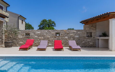 Solis: Water, Sky, Building, Plant, Swimming Pool, Azure, Outdoor Furniture, Shade, Couch, Tree