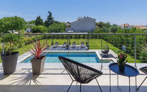 Villa Essea: Water, Plant, Sky, Property, Furniture, Chair, Swimming Pool, Flowerpot, Outdoor Furniture, Tree