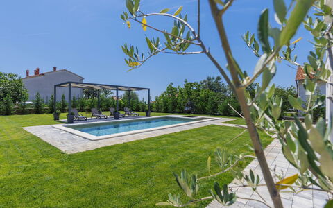 Villa Essea: Plant, Sky, Swimming Pool, Building, Shade, Grass, Leisure, Tree, Condominium, Urban Design