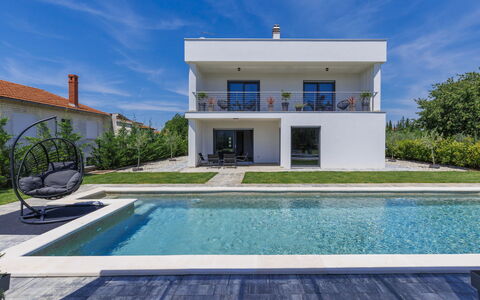 Villa Essea: Sky, Water, Cloud, Plant, Property, Daytime, Building, Azure, Swimming Pool, Rectangle
