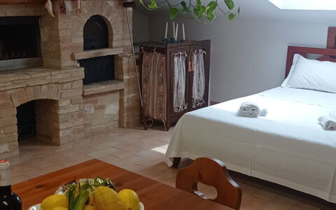 L'attico Di Castelfidardo: Table, Furniture, Food, Property, Wood, Comfort, Tableware, Interior Design, Bottle, Floor