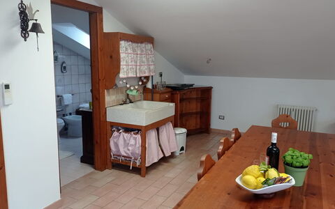 L'attico Di Castelfidardo: Table, Cabinetry, Furniture, Building, Food, Tableware, Drawer, Wood, Chest Of Drawers, Interior Design