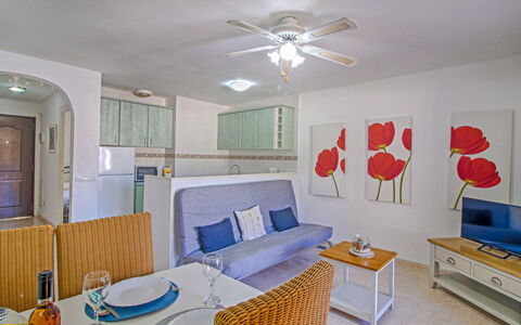 Las Cabañas: Furniture, Property, Table, Ceiling Fan, Comfort, Picture Frame, Living Room, Interior Design, Lighting, Building