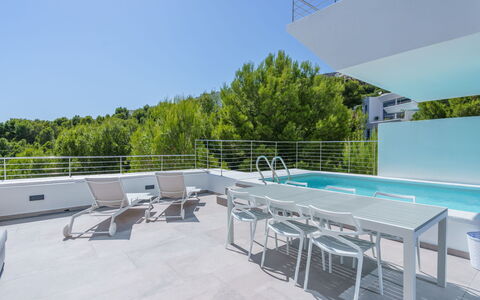 Kristina: Sky, Daytime, Furniture, Water, Building, Swimming Pool, Shade, Outdoor Furniture, Tree, Urban Design