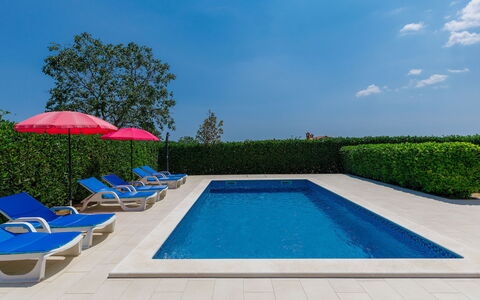 Goga: Water, Sky, Plant, Swimming Pool, Building, Cloud, Azure, Rectangle, Umbrella, Shade