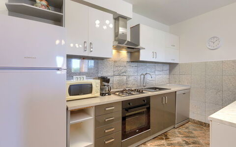 Goga: Countertop, Cabinetry, Building, Tap, Sink, Furniture, Kitchen, Kitchen Sink, Kitchen Stove, Drawer