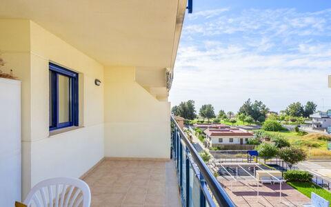 Las Dunas: Sky, Property, Building, Plant, Cloud, Azure, Shade, Wood, Window, Residential Area
