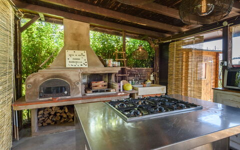 Villa Pancole: Property, Kitchen Appliance, Wood, Countertop, Kitchen Stove, Interior Design, Table, Living Room, Gas Stove, Kitchen