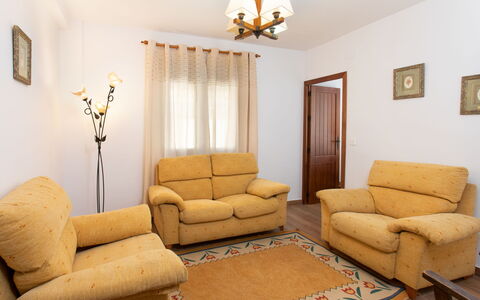 Patio de Las Granadas: Furniture, Couch, Picture Frame, Building, Table, Wood, Lighting, Interior Design, House, Floor