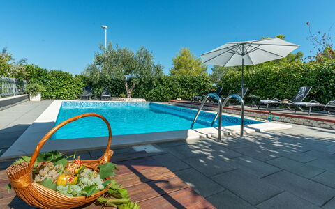 Otavia: Sky, Water, Property, Plant, Swimming Pool, Azure, Shade, Outdoor Furniture, Sunlounger, Tree