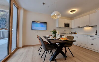 Bergschnucke Homes 335.3: Furniture, Table, Cabinetry, Chair, Wood, Interior Design, Flooring, Countertop, Floor, Living Room
