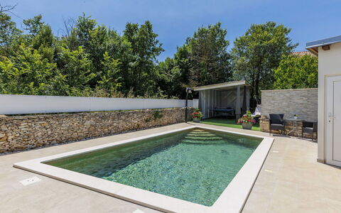 Marija: Swimming Pool, Composite Material, Garden, Water Feature, Backyard, Concrete, Estate, Landscaping, Shade, Resort