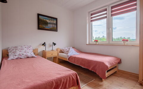 Zagroda Nad Krutynią: Wood, Bedroom, Bed, Home, Floor, Bed Sheet, Bed Frame, Bedding, Dormitory, Room
