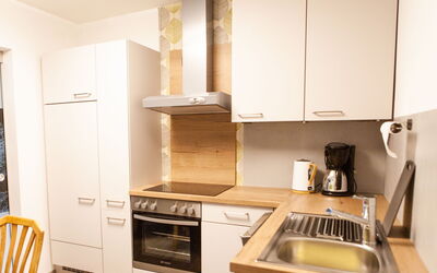 Sonnenhof Top 2 107.2: Cabinetry, Kitchen Sink, Countertop, Kitchen Appliance, Sink, Kitchen Stove, Kitchen, Gas Stove, Home Appliance, Wood