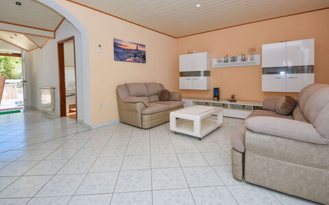 Zorka: Couch, Living Room, Picture Frame, Interior Design, Flooring, Floor, Wood, Wall, Hall, Real Estate