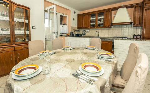 Zorka: Table, Cabinetry, Property, Furniture, Countertop, Interior Design, Wood, Kitchen, Tableware, Tablecloth