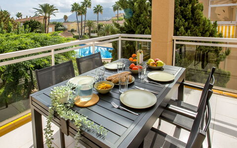 Clemenvillas i: Table, Tableware, Furniture, Plant, Sky, Flowerpot, Chair, Food, Dishware, Cloud