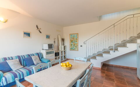 Capo Testa: Table, Furniture, Couch, Chair, Building, Wood, Interior Design, Flooring, Floor, House