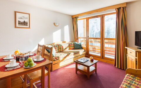Valloire 651: Table, Furniture, Property, Window, Comfort, Picture Frame, Wood, Interior Design, Orange, Living Room