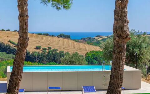 Villa Elpidio: Sky, Plant, Property, Water, Building, Azure, Nature, Shade, Tree, Arecales