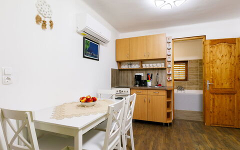 Liget: Table, Cabinetry, Furniture, Countertop, White, Chair, Wood, Lighting, Kitchen, Interior Design