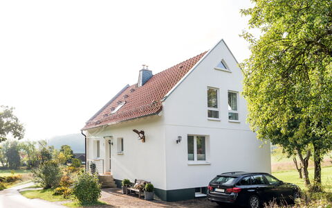 Forsthaus Gut Malberg: Snow, Sky, Mountain, Window, Cloud, Building, House, Slope, Tree, Cottage